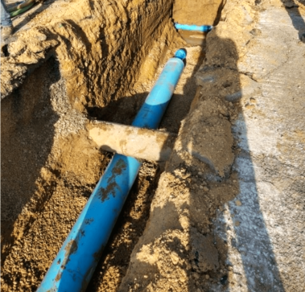 Protected water main in water distribution layout.